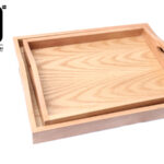 Set of two wooden trays with handles.