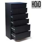 Black 6-drawer chester with a modern laminated board design