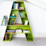 Green A-shaped floor shelf with multiple compartments for storage.