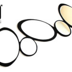 "Abstract wall-hanging mirror with oval reflective surfaces and a black frame."