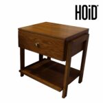 Wooden Mika side table with a drawer and lower shelf in an oak finish.