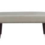 "Front view of an off-white velvet 2-seater bench with dark wooden legs and nailhead trim - available in karachi."