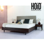 "Bedroom set featuring one patterned bed paired with two side tables – available in Karachi."