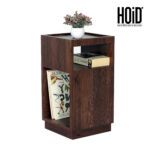 Wooden side table with open shelves for storage and a decorative top surface.
